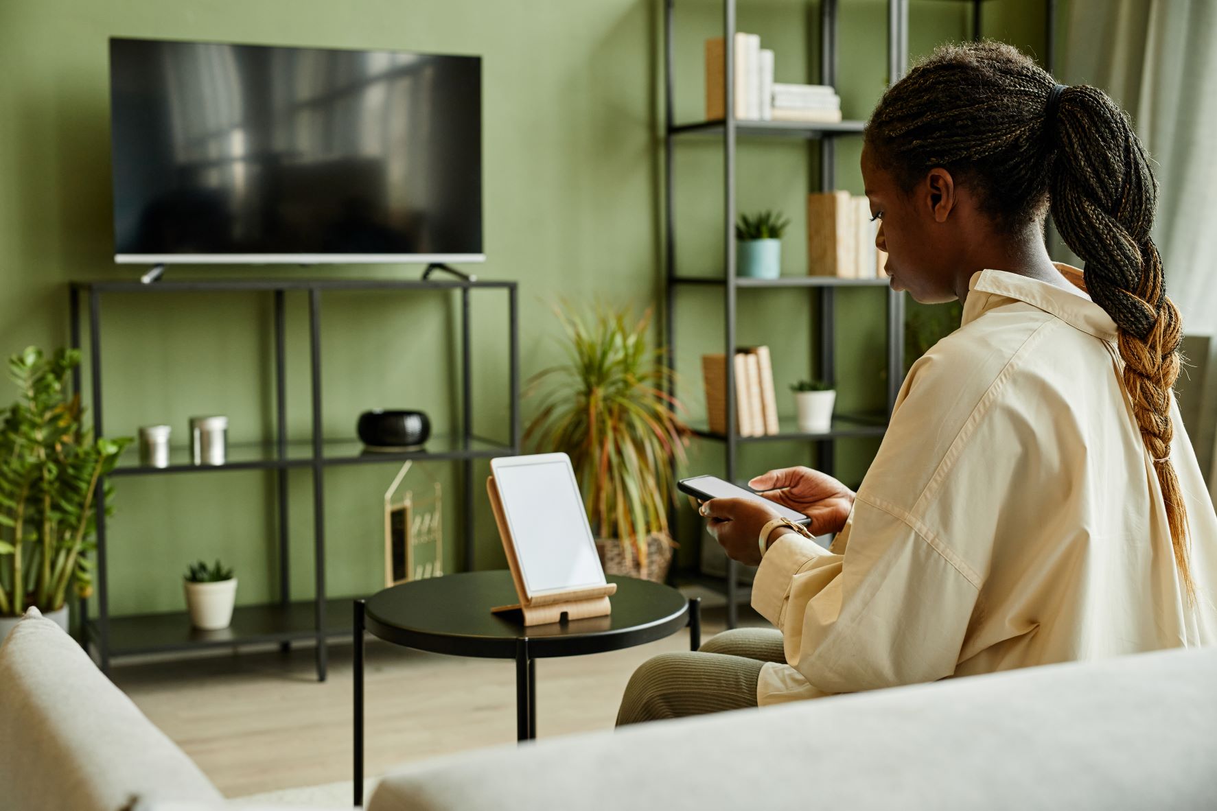 woman connecting phone to smart home system