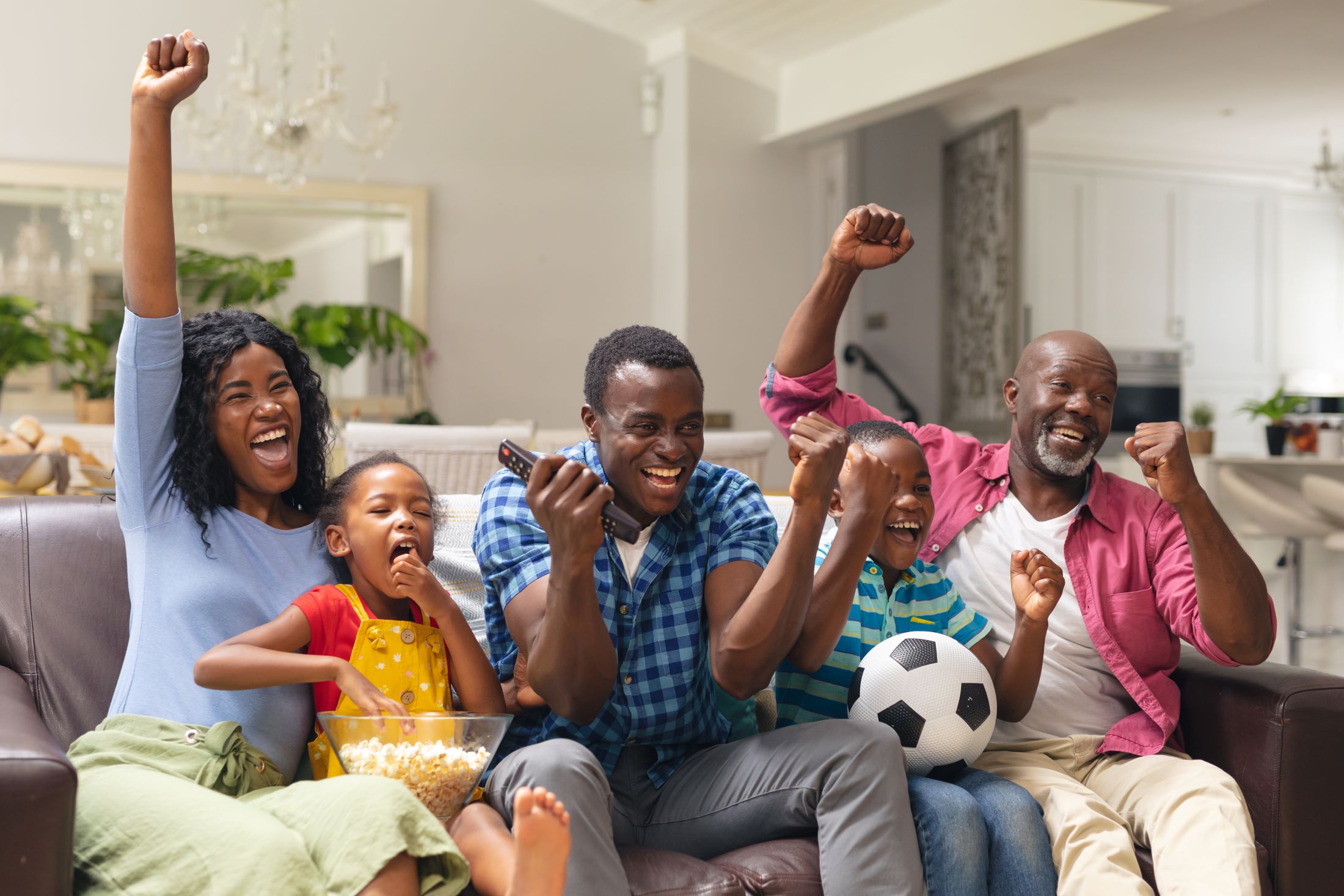 african american multi generational family cheering
