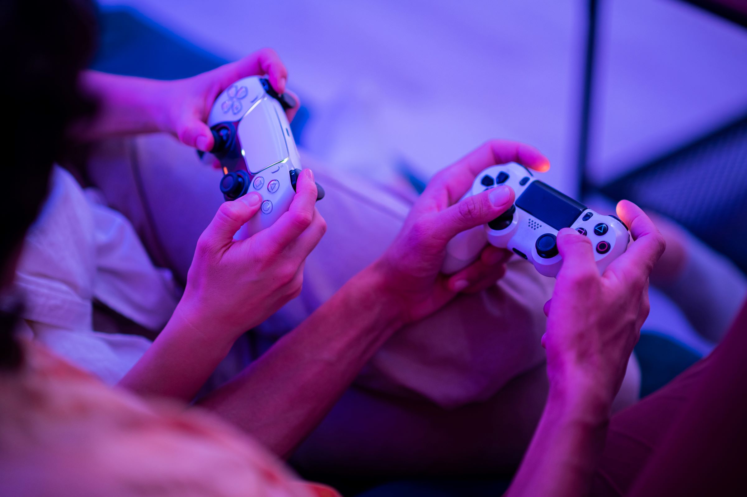 young adult couple boy and girl playing video game