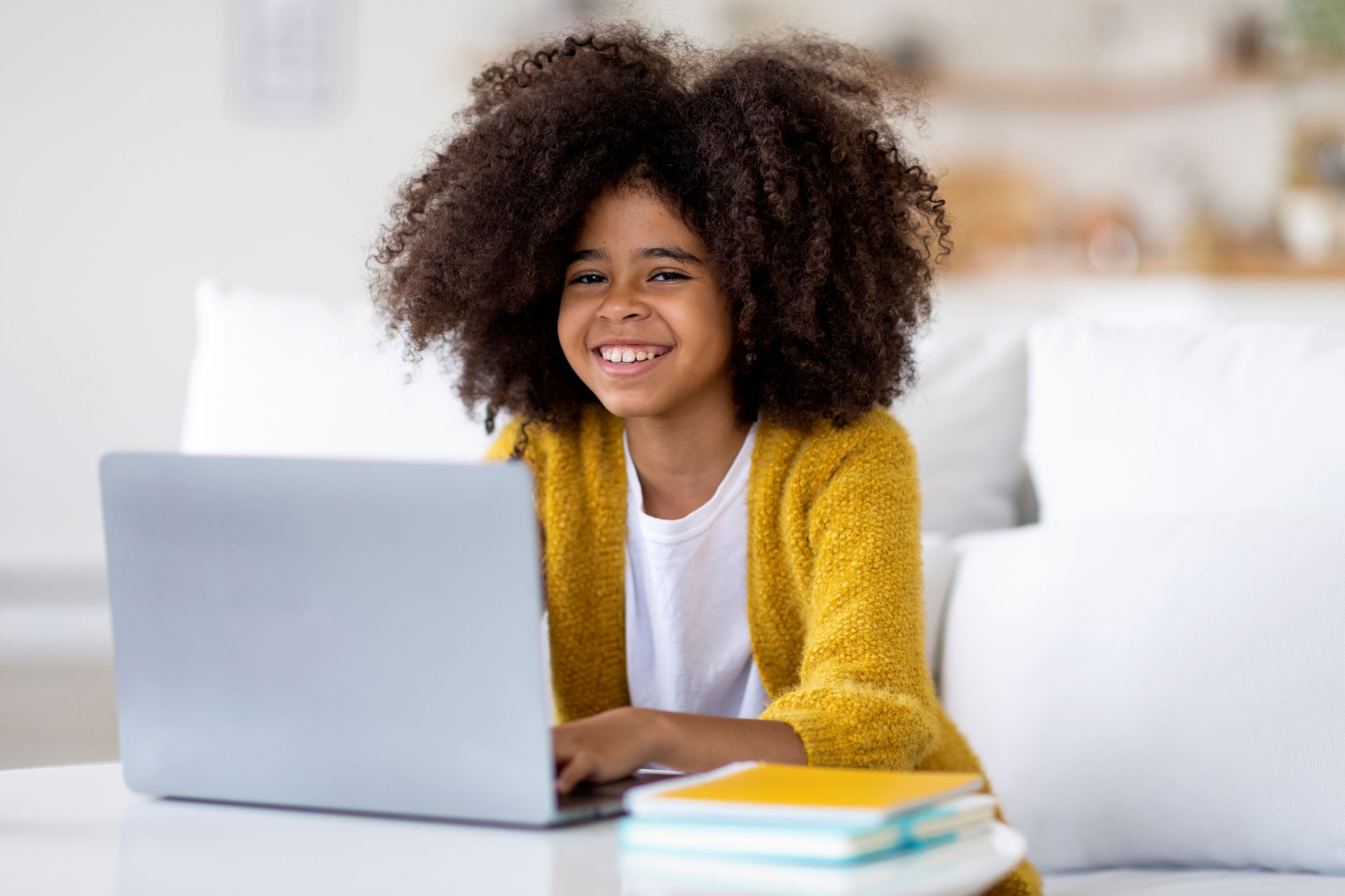 positive african american child studying from home
