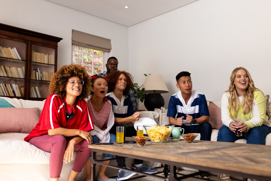 happy-diverse-group-of-friends-with-snacks-on-table