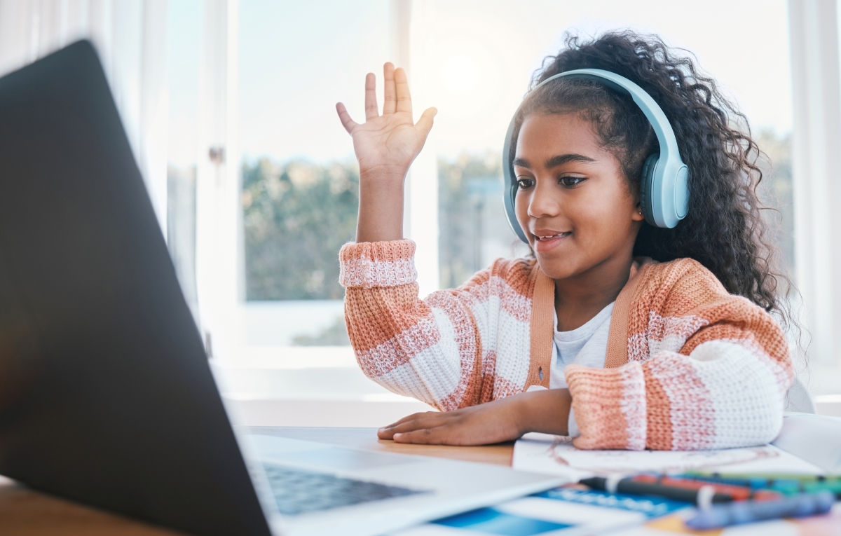 education-laptop-and-kid-with-headphones-for-class