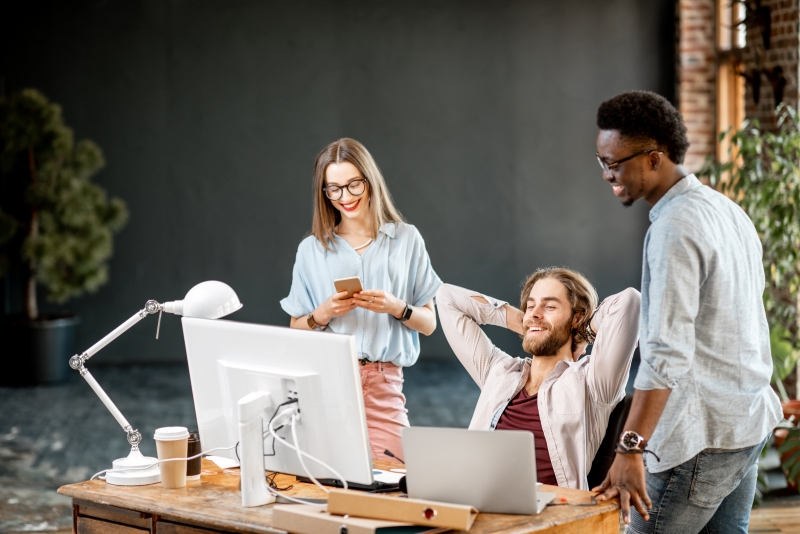 young-coworkers-working-with-computer-indoors